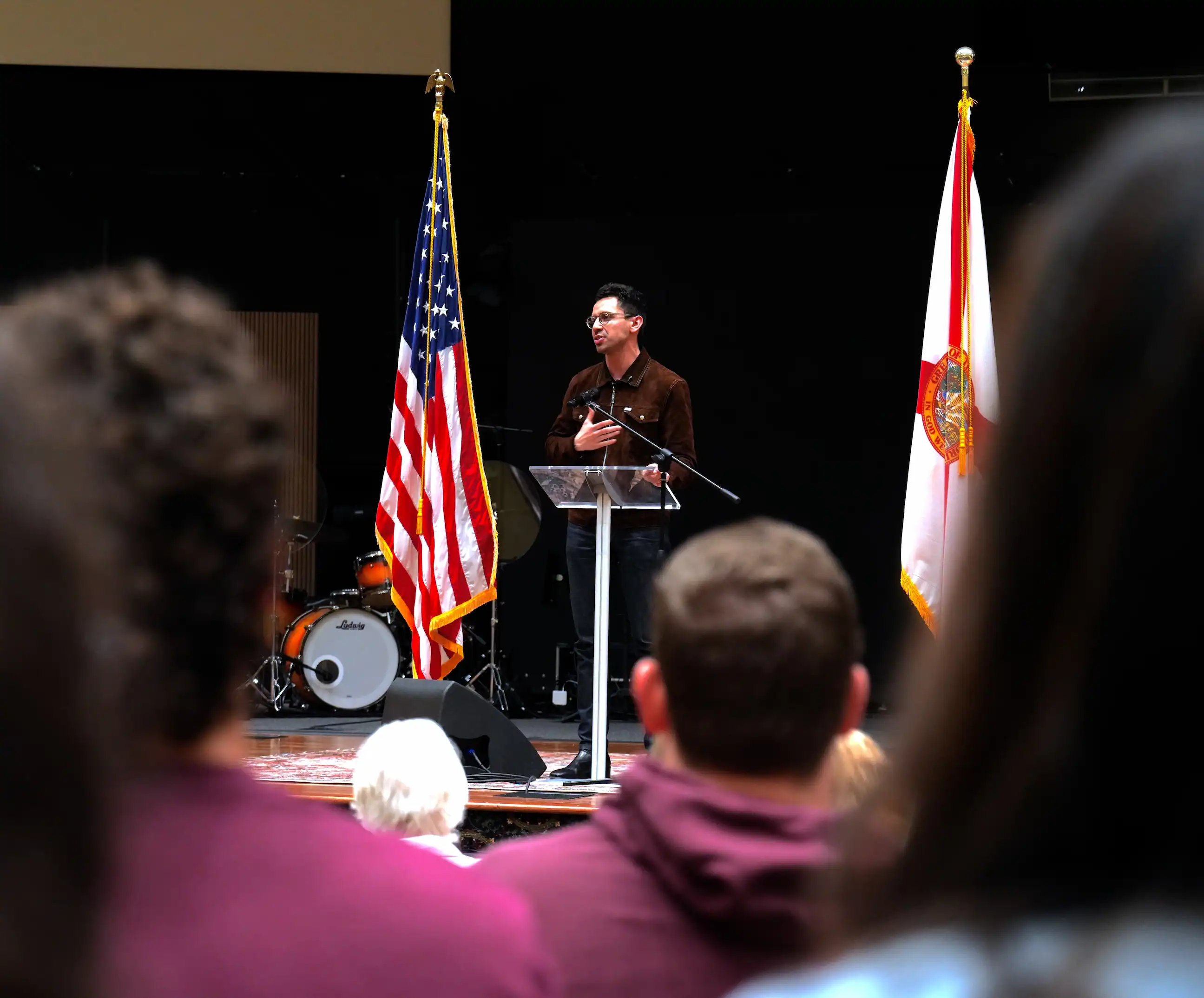 Addressing a high-energy crowd at Marcus Pointe Baptist Church on the pillars of faith and family values.