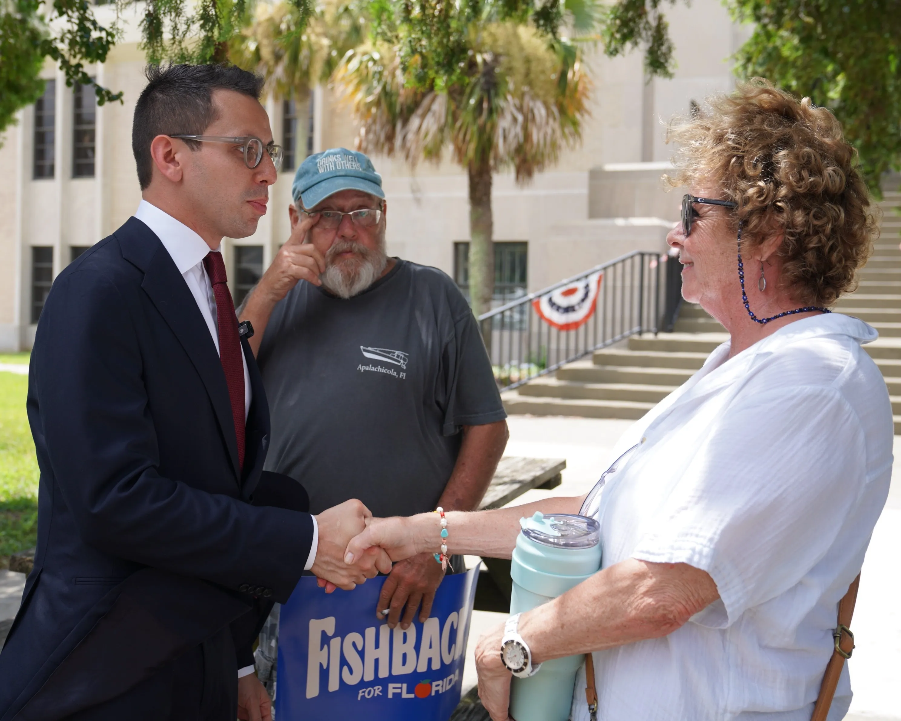 Supporters gather as the 67-county tour reaches Apalachicola.