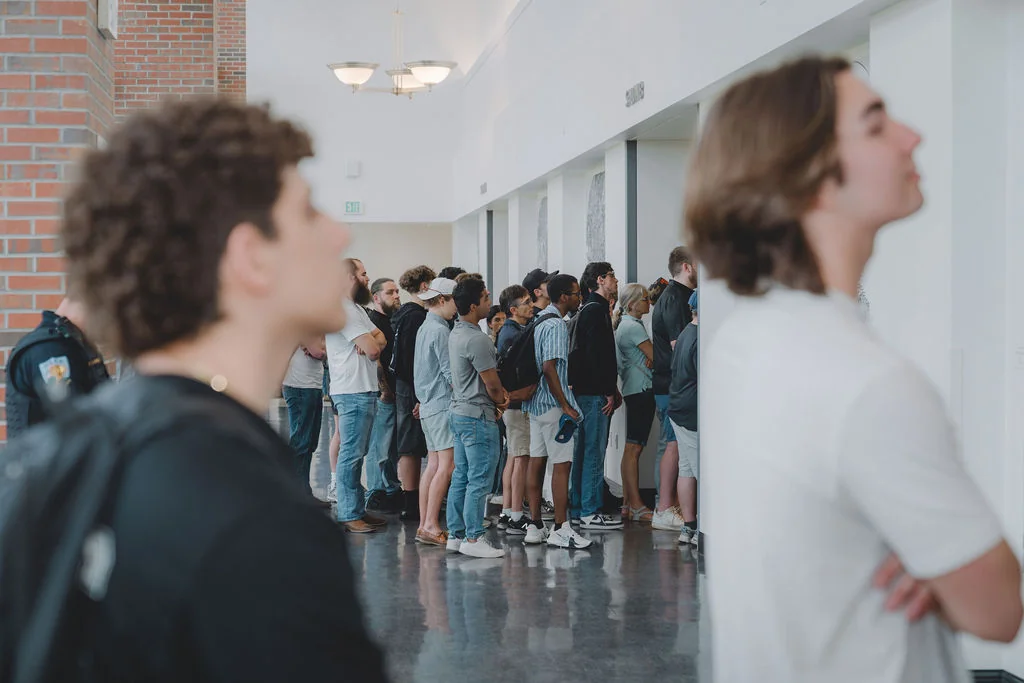 A line streching out from the room around the entire building