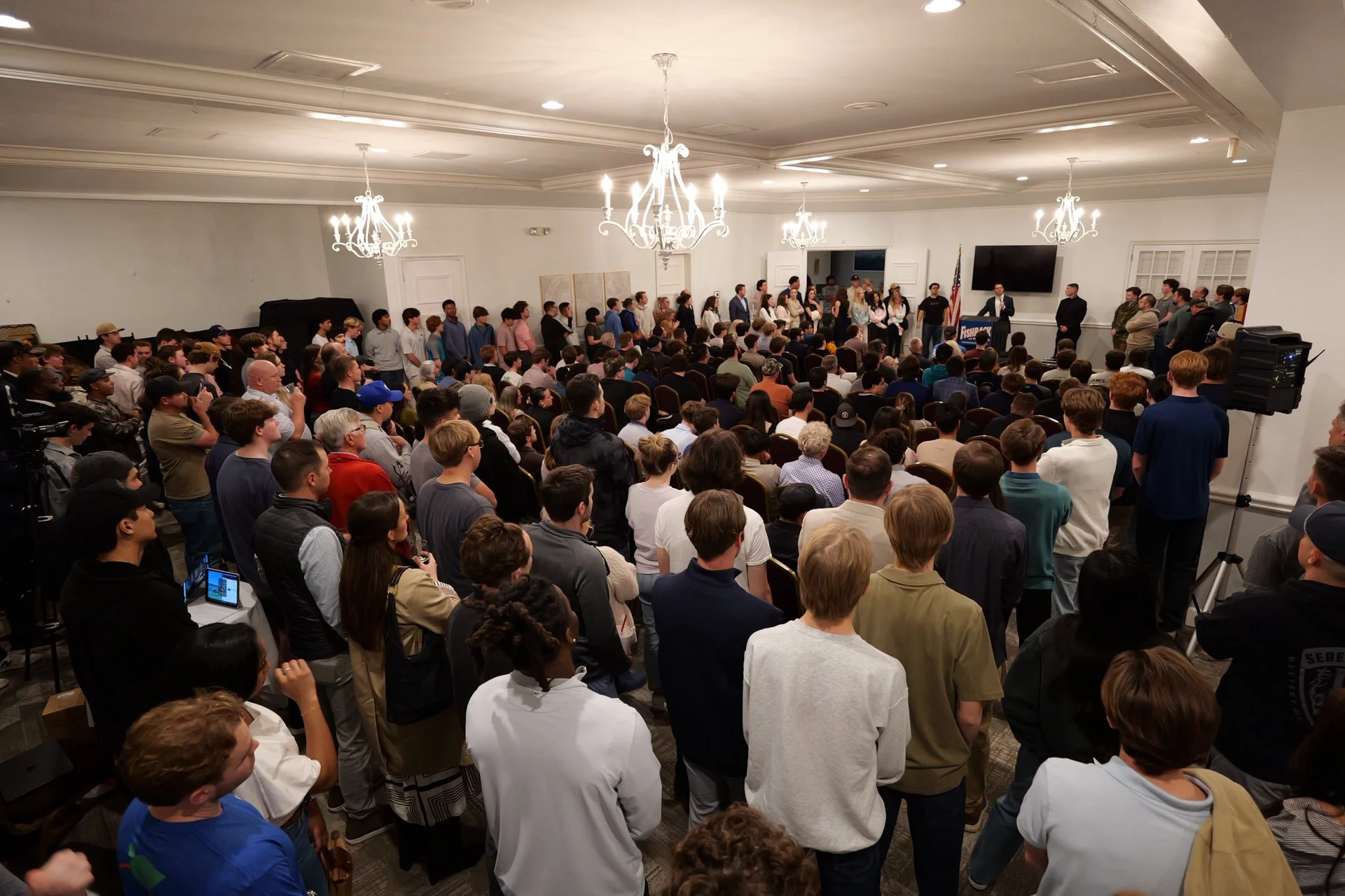 Packed crowd fills the ballroom as Fishback speaks on banning private equity firms from buying single-family homes