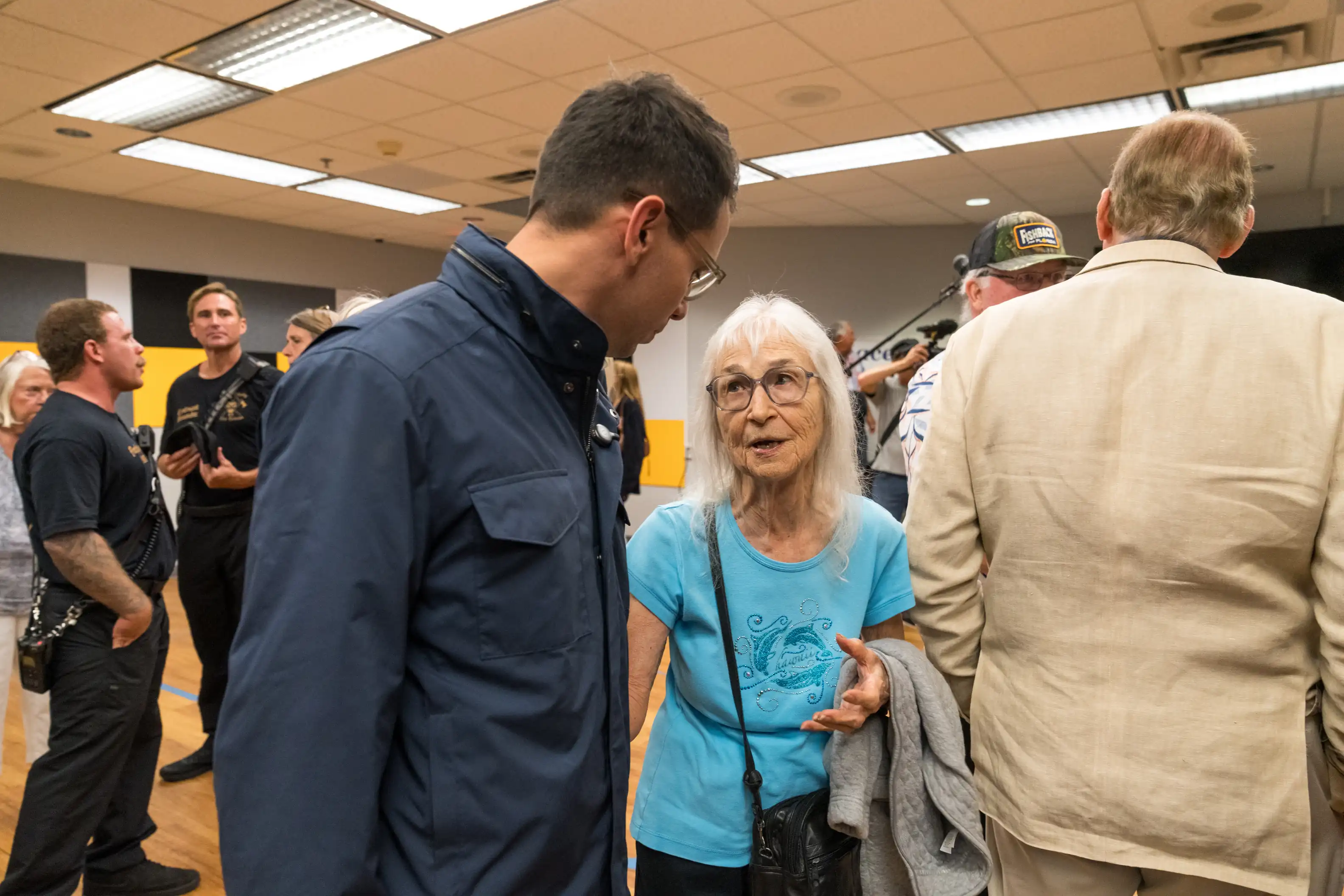 Fishback speaks with attendees after the Merritt Island stop.