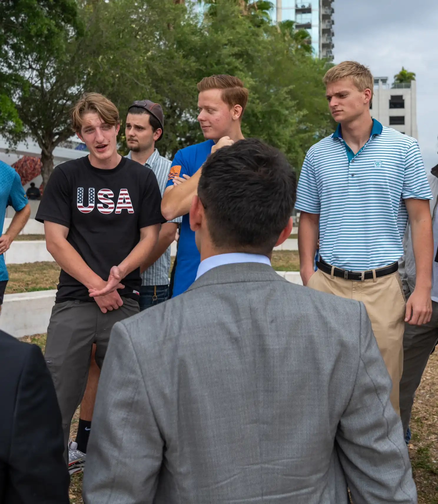 The campaign team speaks with attendees after the Tampa press conference.